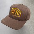brown herringbone hat with oxyd logo.